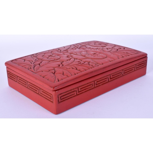 52 - TWO EARLY 20TH CENTURY CHINESE RED LACQUER ITEMS including a jade pendant. Largest 15 cm wide. (3)