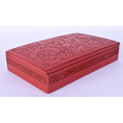 52 - TWO EARLY 20TH CENTURY CHINESE RED LACQUER ITEMS including a jade pendant. Largest 15 cm wide. (3)