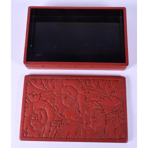 52 - TWO EARLY 20TH CENTURY CHINESE RED LACQUER ITEMS including a jade pendant. Largest 15 cm wide. (3)