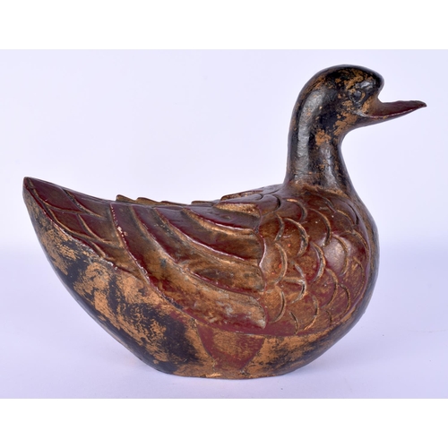 56 - A RARE CHINESE QING DYNASTY LACQUERED WOOD FIGURE OF A DUCK of naturalistic form. 20 cm x 18 cm.