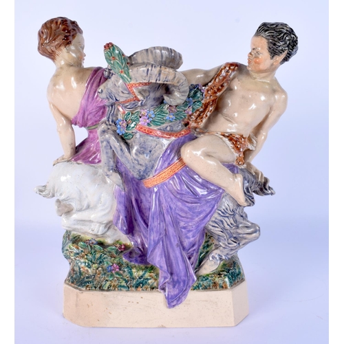 59 - A LARGE CHARLES VYSE FIGURE OF PAN AND A FEMALE modelled riding upon clashing rams. 24 cm x 17 cm.
