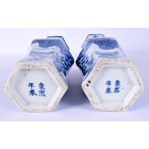 60 - A PAIR OF 19TH CENTURY CHINESE BLUE AND WHITE PORCELAIN VASES bearing Kangxi marks to base. 26 cm hi... 