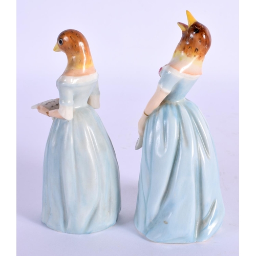 101 - Royal Worcester candle snuffers modelled as Confidence and Diffidence with matching blue dresses. 11... 