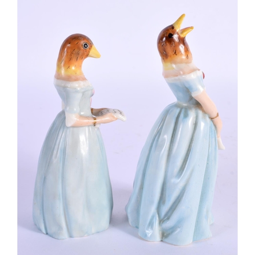 101 - Royal Worcester candle snuffers modelled as Confidence and Diffidence with matching blue dresses. 11... 