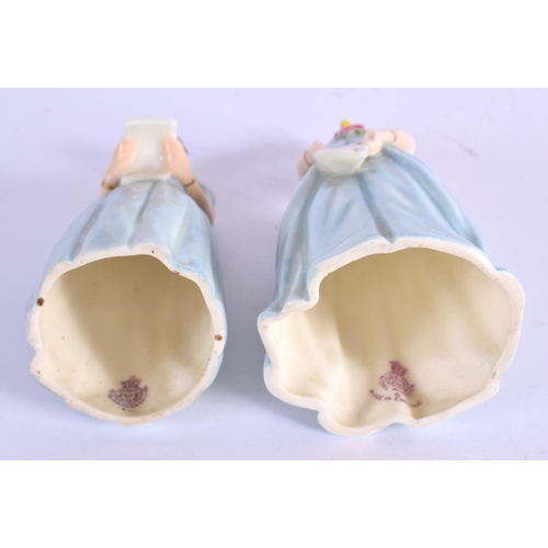 101 - Royal Worcester candle snuffers modelled as Confidence and Diffidence with matching blue dresses. 11... 