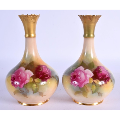 103 - Royal Worcester pair of vases  painted with roses shape G702 date mark 1924. 14cm high.