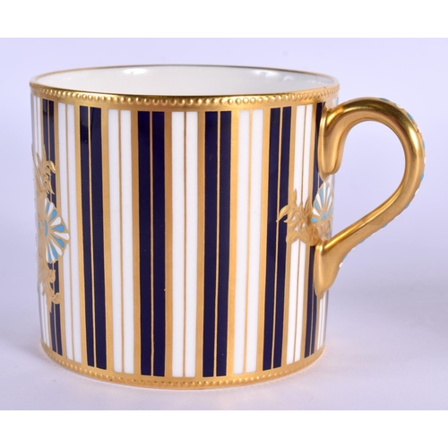 120 - Lynton Porcelain (Derby) 'jewelled' coffee can and saucer by Stefan Nowacki, signed,: painted with a... 