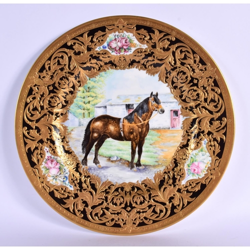 121 - Lynton Porcelain cabinet plate decorated with a racehorse standing beside a stable block, with a hea... 