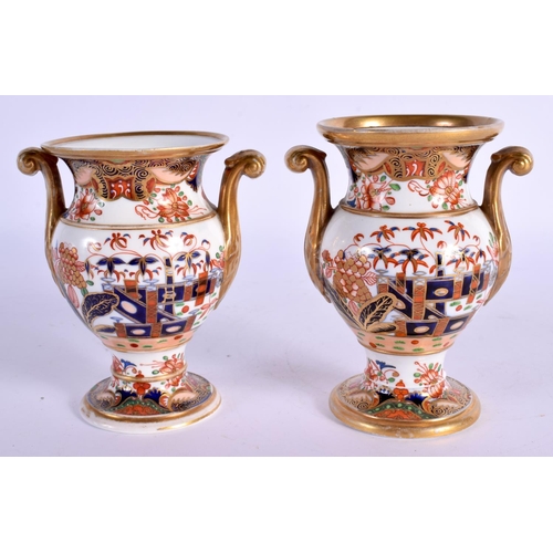 14 - A PAIR OF EARLY 19TH CENTURY SPODE TWIN HANDLED PORCELAIN VASES painted with imari landscapes. 10 cm... 