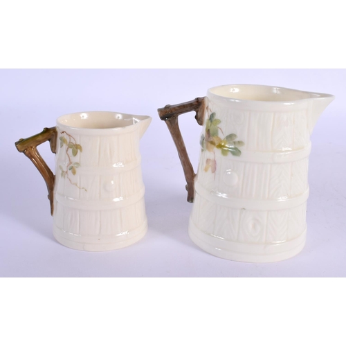 144 - Royal Worcester two barrel shaped jugs painted with a bullfinch or a wrythen both signed one by W. P... 