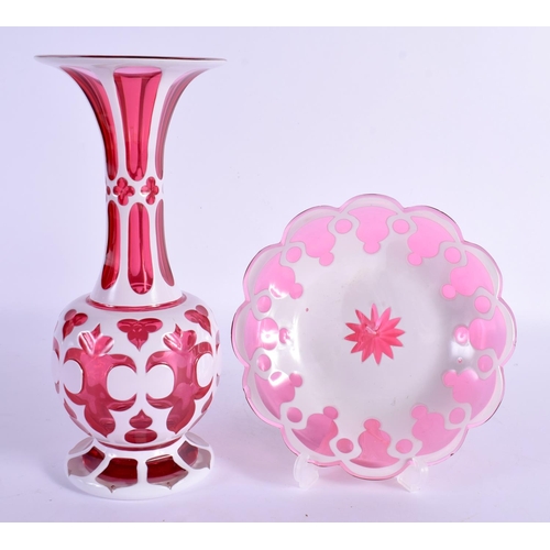 15 - A BOHEMIAN RUBY AND WHITE OVERLAID FLASH VASE ON STAND decorated with motifs. 27 cm high.