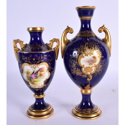 158 - Late 19th / early 20th c. Coalport two handled vase painted with a landscape in a gilt panel on a bl... 