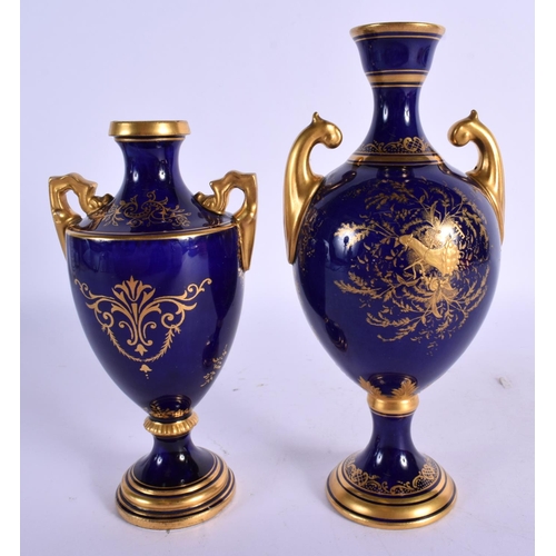 158 - Late 19th / early 20th c. Coalport two handled vase painted with a landscape in a gilt panel on a bl... 