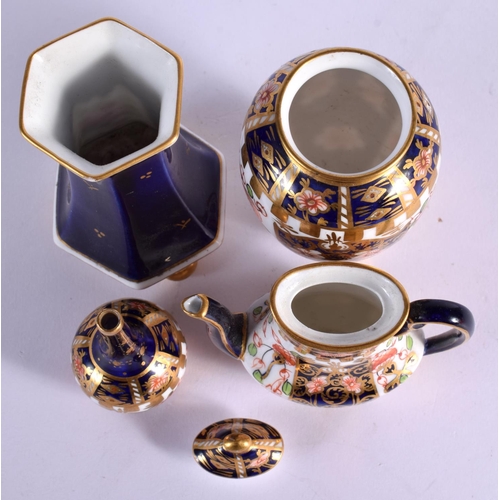 160 - Royal Crown Derby miniature coffee pot and cover pattern 6299, date mark 1912, a similar miniature b... 