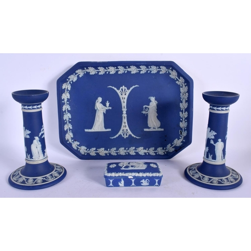 21 - AN UNUSUAL WEDGWOOD BLUE BASALT DESK SET decorated with classical figures. Largest 25 cm wide. (4)