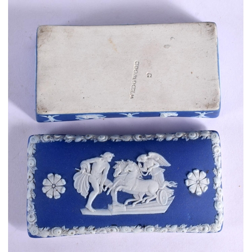 21 - AN UNUSUAL WEDGWOOD BLUE BASALT DESK SET decorated with classical figures. Largest 25 cm wide. (4)