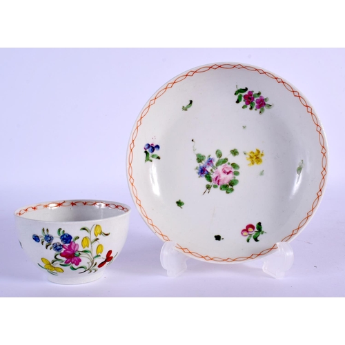 223 - Bristol teabowl and saucer painted with flowers under a red chainlink border