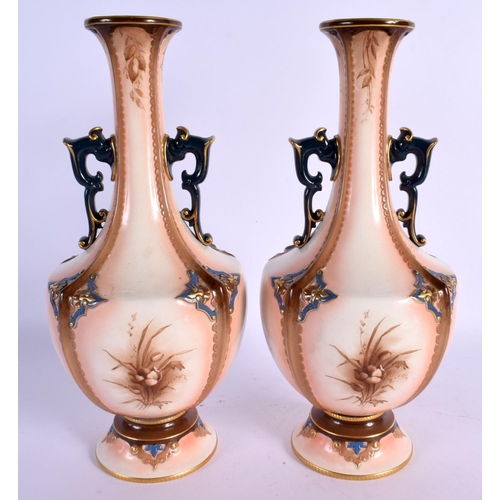 237 - Hadley good painted of two handled vases painted with flowers and fruit on a flesh coloured ground, ... 