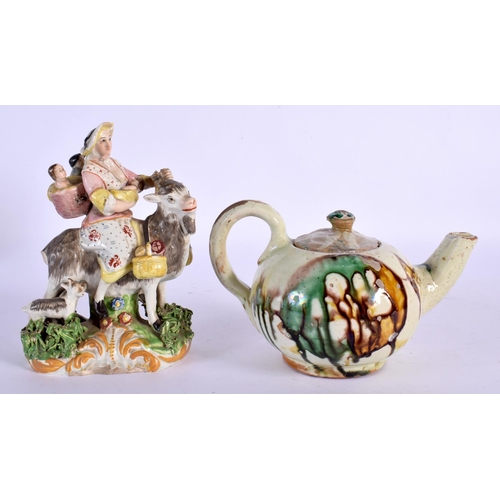 25 - A 19TH CENTURY ENGLISH PORCELAIN FIGURE OF THE TAILORS WIFE together with a majolica glazed teapot. ... 