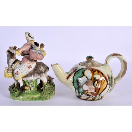 25 - A 19TH CENTURY ENGLISH PORCELAIN FIGURE OF THE TAILORS WIFE together with a majolica glazed teapot. ... 