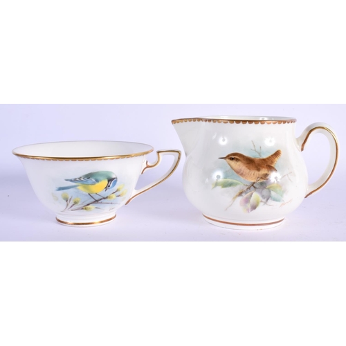 259 - Royal Worcester cup and saucer painted with a Bluetit and Linnet by D. Jones, signed, date mark blac... 