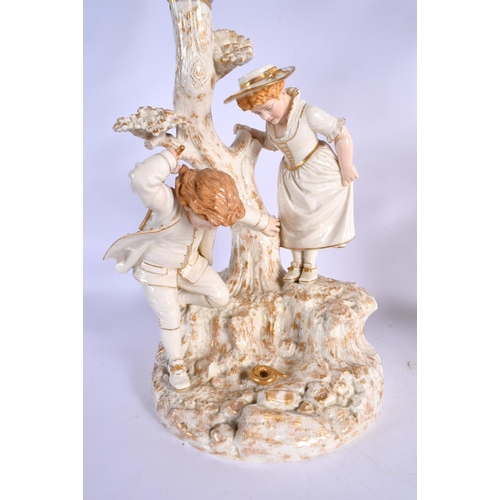 272 - Royal Worcester pair of candelabra after models by James Hadley of a boy and girl collecting birds e... 