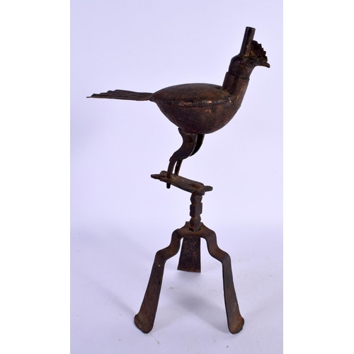 293 - AN EARLY CONTINENTAL SHEET METAL BIRD OIL LAMP. 25 cm high.