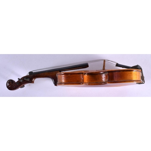 297 - A CASED VINTAGE MINIATURE VIOLIN with bow. 16 cm long.