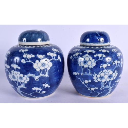 300 - A MATCHED PAIR OF 19TH CENTURY CHINESE BLUE AND WHITE GINGER JARS Kangxi style. 15 cm x 11 cm.