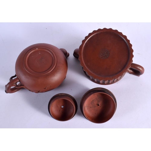 304 - TWO EARLY 20TH CENTURY CHINESE YIXING POTTERY TEAPOTS AND COVERS Late Qing/Republic. Largest 16 cm w... 