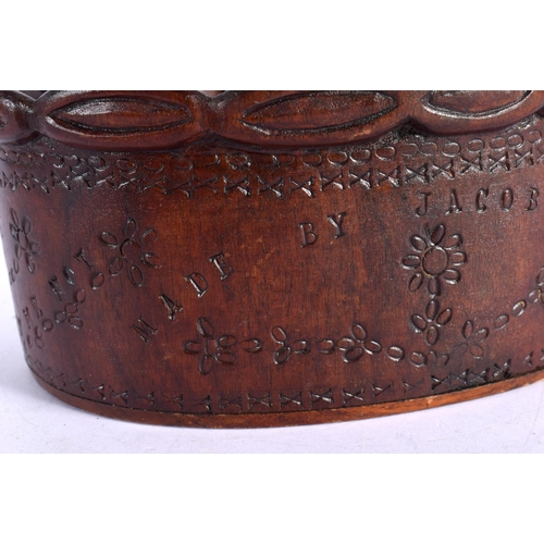 306 - A RARE PITCAIRN ISLANDS CARVED WOOD BASKET by Jacob Warren. 17 cm x 15 cm.