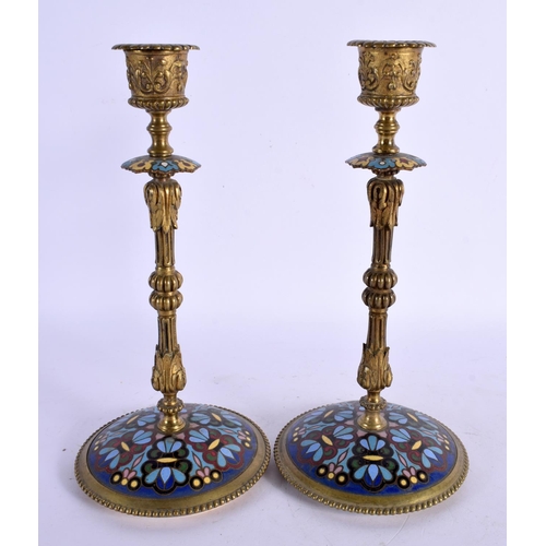 311 - A PAIR OF 19TH CENTURY FRENCH CHAMPLEVE ENAMEL CANDLESTICKS decorated with foliage. 24 cm high.