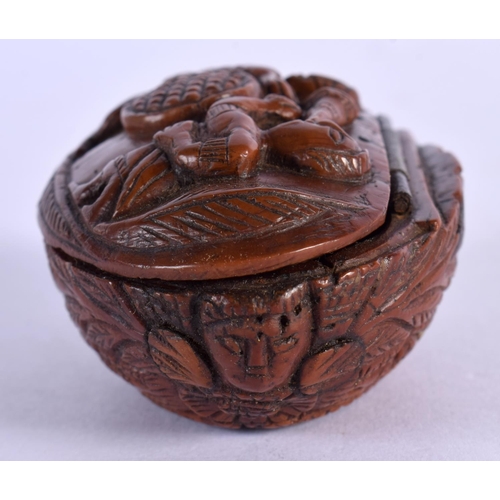 316 - AN 18TH/19TH CENTURY CONTINENTAL CARVED COQUILLA NUT SNUFF BOX decorated with figures. 7 cm x 4.5 cm... 