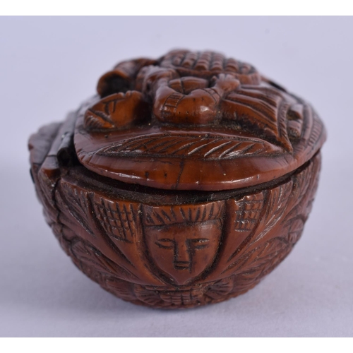 316 - AN 18TH/19TH CENTURY CONTINENTAL CARVED COQUILLA NUT SNUFF BOX decorated with figures. 7 cm x 4.5 cm... 