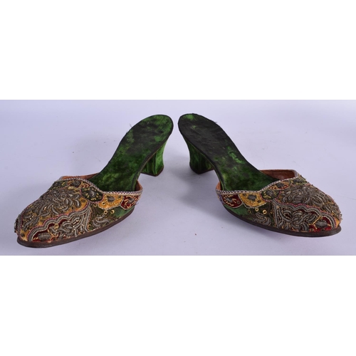 320 - A PAIR OF 18TH CENTURY BEADWORK SLIPPERS decorated with foliage. 24 cm long.