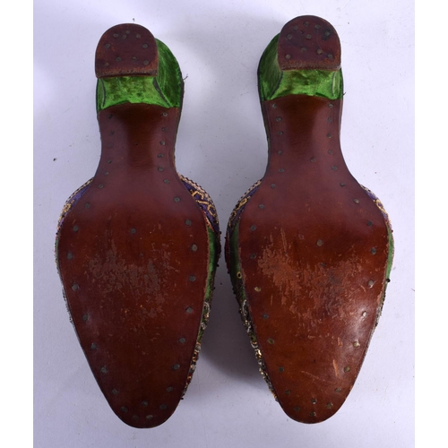 320 - A PAIR OF 18TH CENTURY BEADWORK SLIPPERS decorated with foliage. 24 cm long.