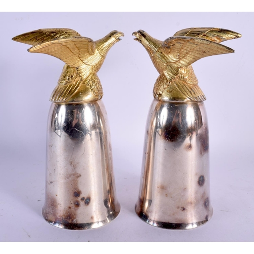 327 - A PAIR OF SILVER PLATED EAGLE STIRRUP CUPS. 20 cm high.