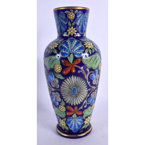 329 - A RARE EARLY 20TH CENTURY EUROPEAN ENAMELLED GLASS VASE painted with foliage. 21.5 cm high.