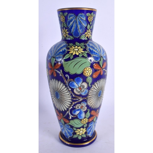 329 - A RARE EARLY 20TH CENTURY EUROPEAN ENAMELLED GLASS VASE painted with foliage. 21.5 cm high.