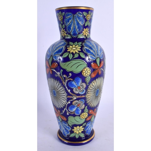 329 - A RARE EARLY 20TH CENTURY EUROPEAN ENAMELLED GLASS VASE painted with foliage. 21.5 cm high.