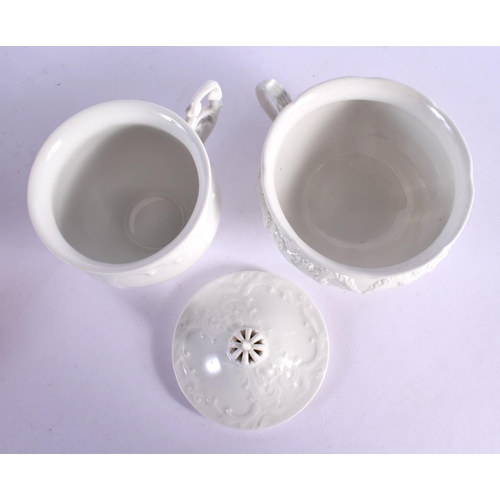 33 - A PAIR OF KPM BERLIN CUPS AND SAUCERS moulded with foliage. 15 cm x 15 cm. (2)