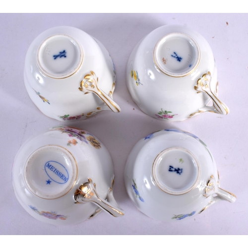 34 - FOUR MEISSEN PORCELAIN CUPS AND SAUCERS painted with flowers. 10 cm wide. (8)