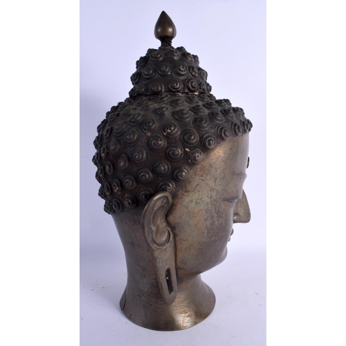 347 - A LARGE 19TH CENTURY CHINESE BRONZE BUDDHA HEAD with moonstone inlay. 38 cm x 14 cm.