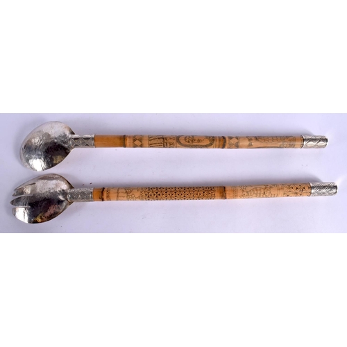 349 - A PAIR OF VINTAGE ASIAN WHITE METAL SALAD SERVERS. 44 cm long.