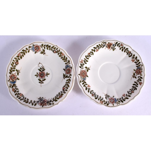 35 - A PAIR OF MEISSEN CUPS AND SAUCERS painted with flowers. 12 cm wide. (4)