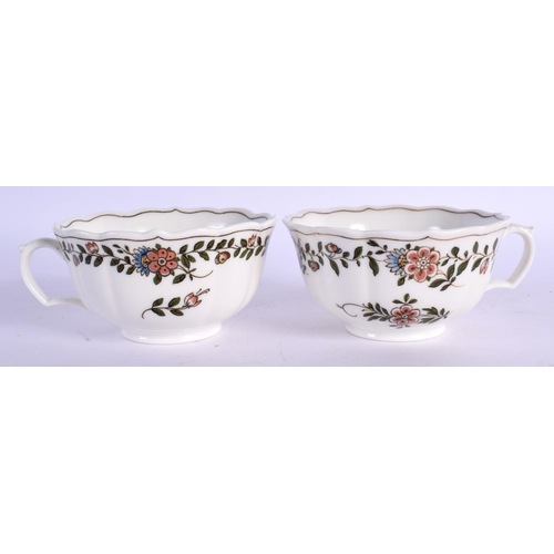 35 - A PAIR OF MEISSEN CUPS AND SAUCERS painted with flowers. 12 cm wide. (4)