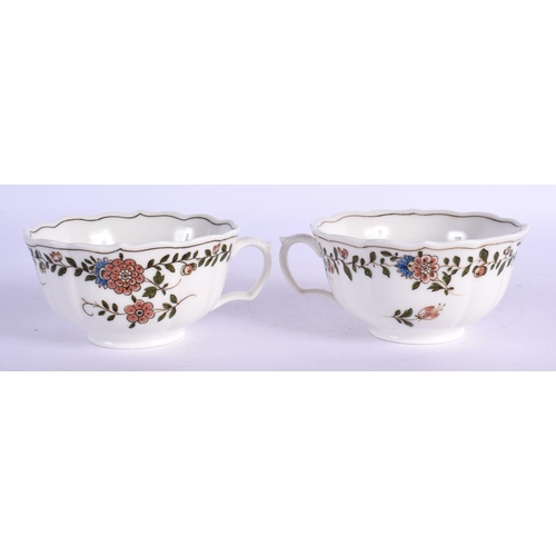 35 - A PAIR OF MEISSEN CUPS AND SAUCERS painted with flowers. 12 cm wide. (4)