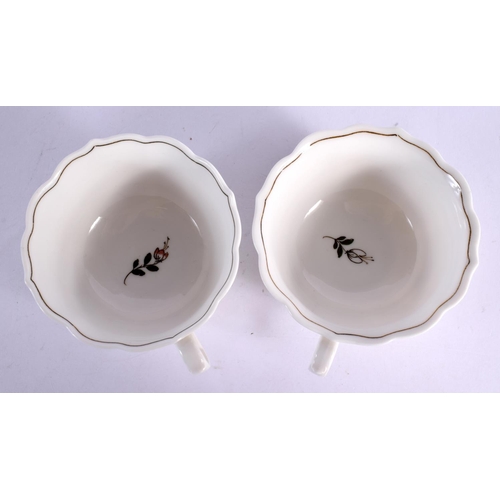 35 - A PAIR OF MEISSEN CUPS AND SAUCERS painted with flowers. 12 cm wide. (4)