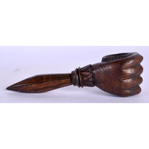 351 - A LATE 19TH CENTURY EUROPEAN CARVED WOOD FIST NUT CRACKER of tapering form. 15.5 cm wide.