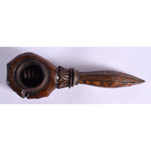 351 - A LATE 19TH CENTURY EUROPEAN CARVED WOOD FIST NUT CRACKER of tapering form. 15.5 cm wide.